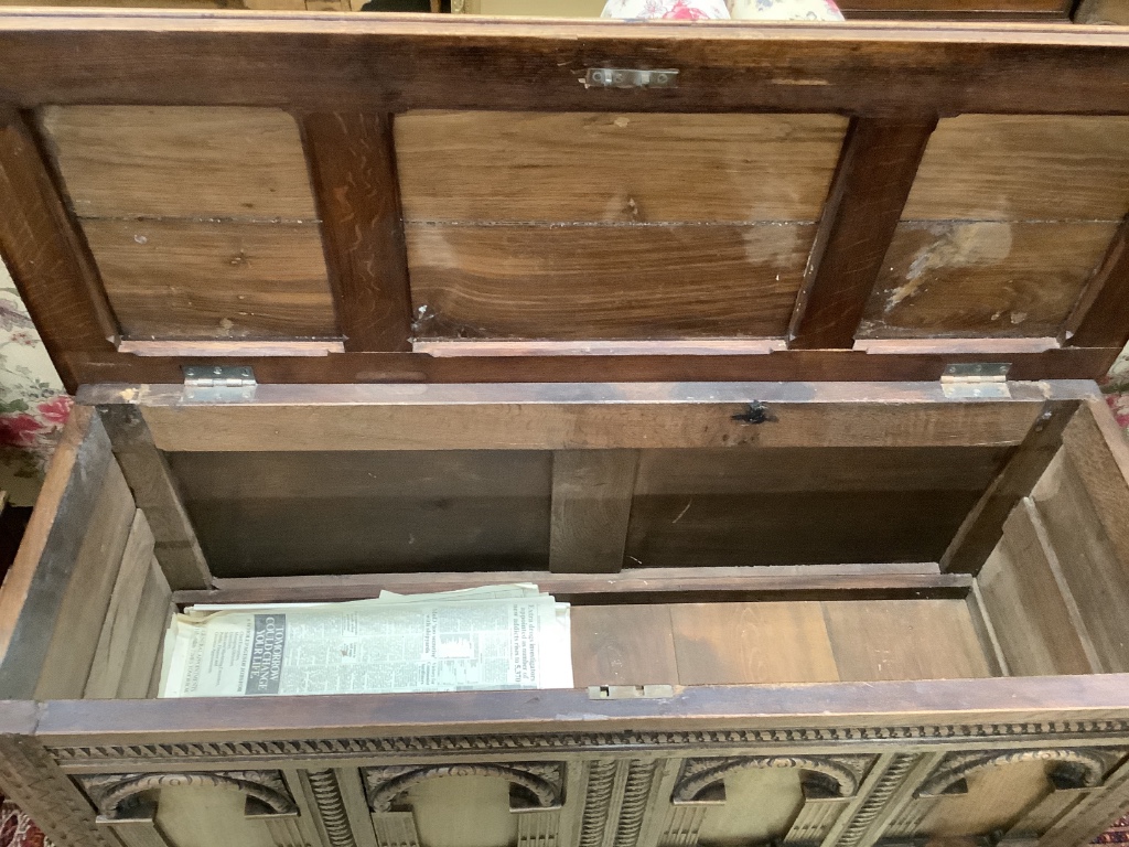 An 18th century and later oak coffer with arch panelled front, width 142cm depth 52cm height 68cm